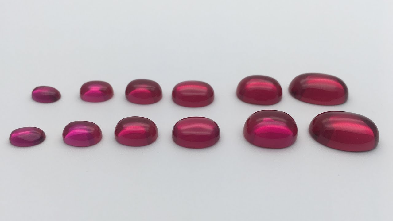 cabochon shaped carved in rhodochrosite oval